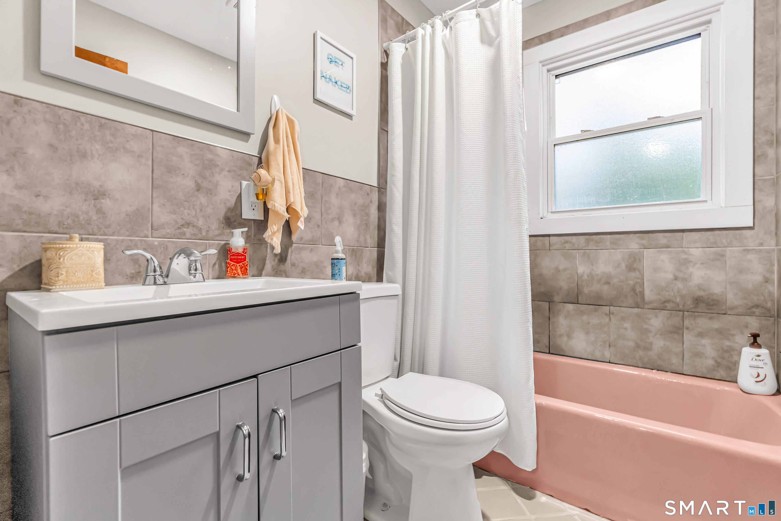 252 Bear Paw Road Bridgeport, CT 06606 - Photo 13 of 25 a bathroom with a sink a toilet and shower