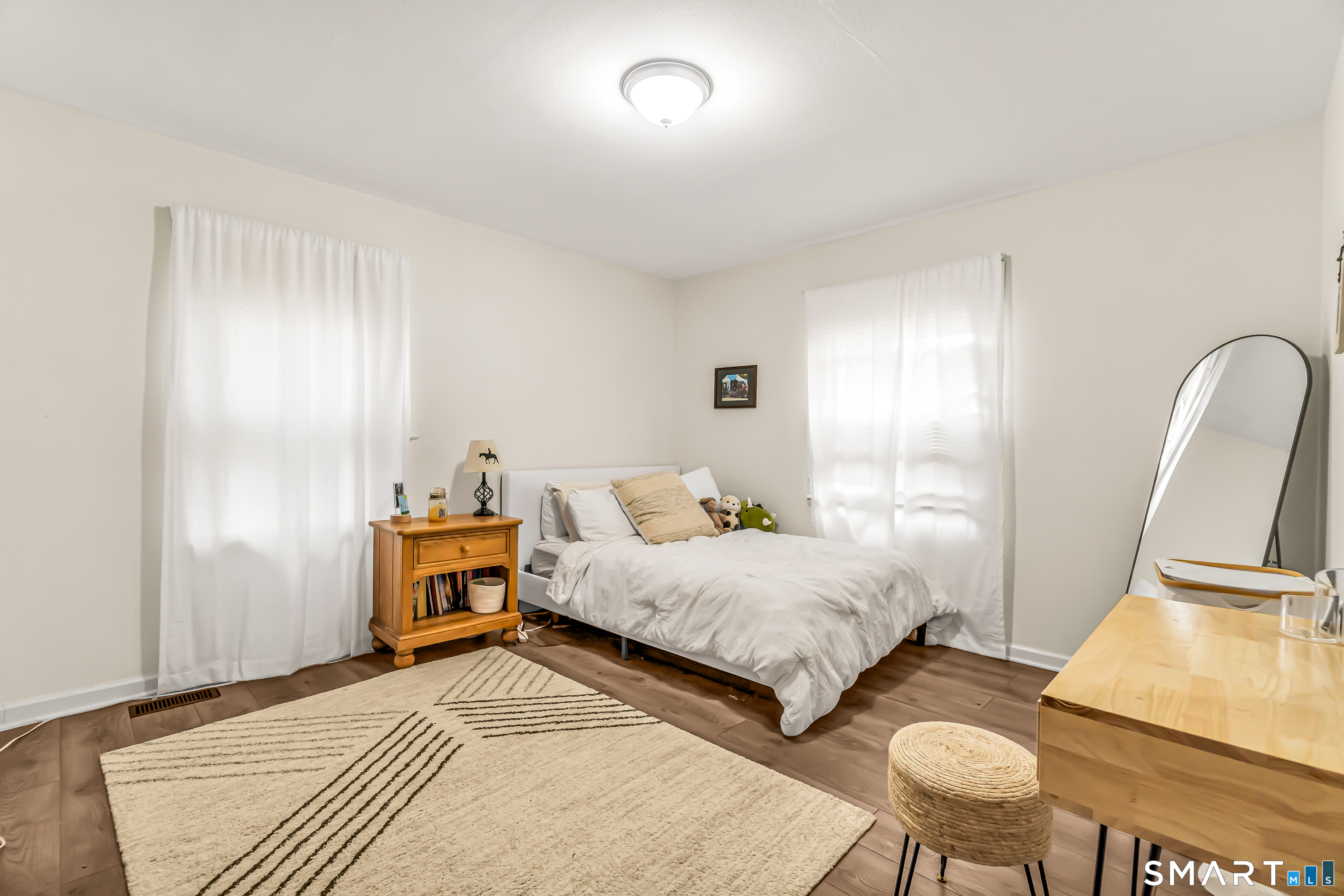 252 Bear Paw Road Bridgeport, CT 06606 - Photo 15 of 25 a bedroom with bed and a night stand