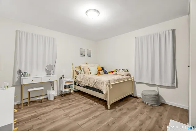 a bedroom with a bed and a table