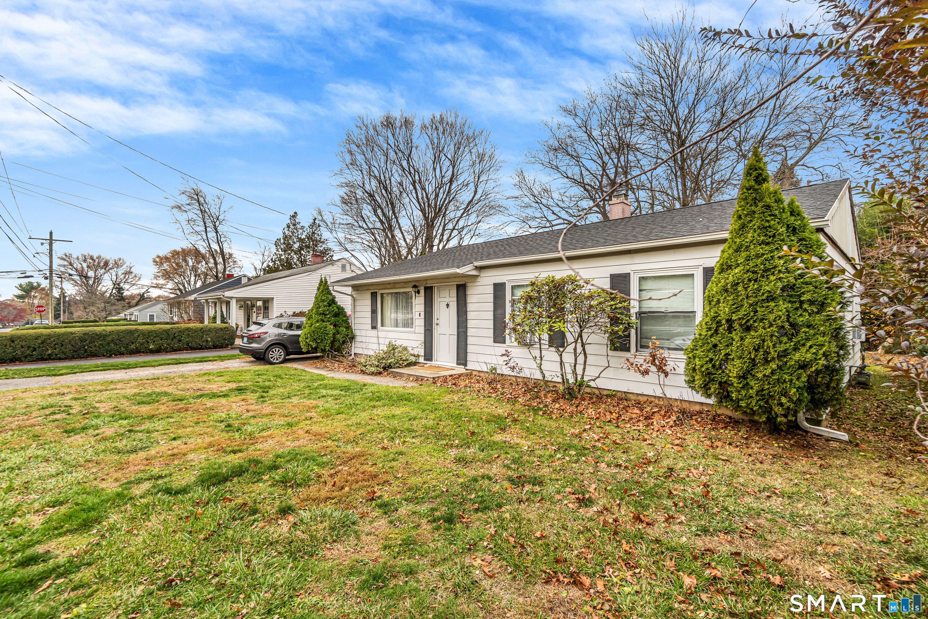 252 Bear Paw Road Bridgeport, CT 06606 - Photo 20 of 25 a front view of a house with a garden