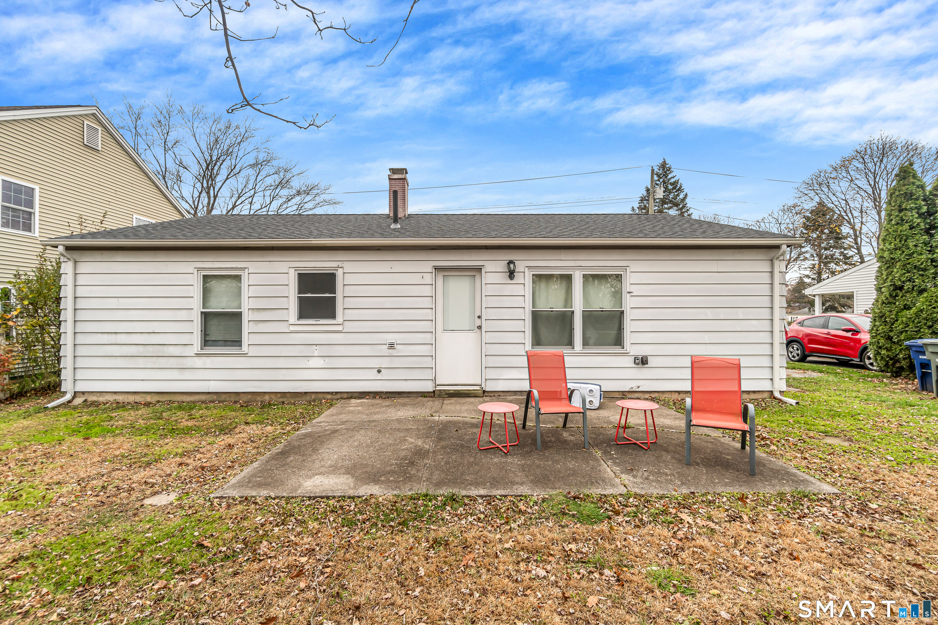 252 Bear Paw Road Bridgeport, CT 06606 - Photo 23 of 25 a backyard of a house with outdoor seating