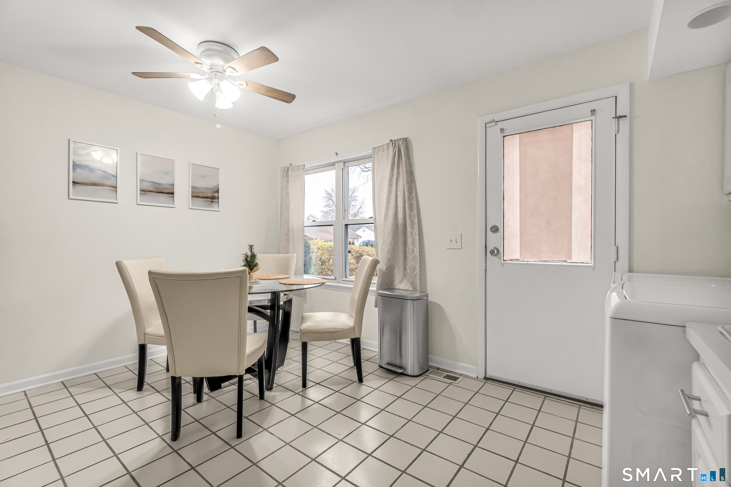 252 Bear Paw Road Bridgeport, CT 06606 - Photo 7 of 25 a view of a dining room with furniture and chandelier fan