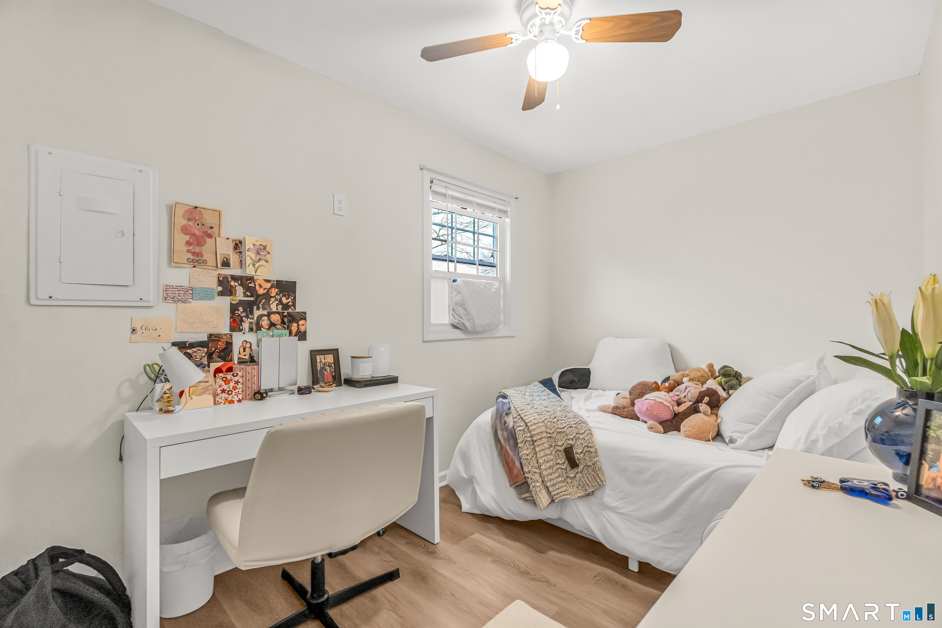 252 Bear Paw Road Bridgeport, CT 06606 - Photo 8 of 25 a bedroom with a bed and a table chair