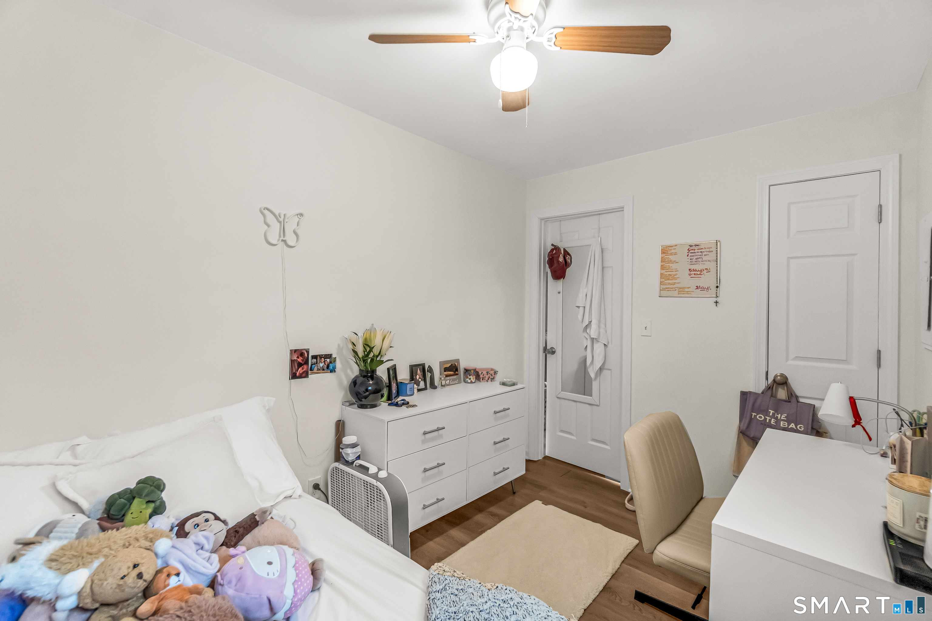 252 Bear Paw Road Bridgeport, CT 06606 - Photo 9 of 25 a living room with furniture and wooden floor