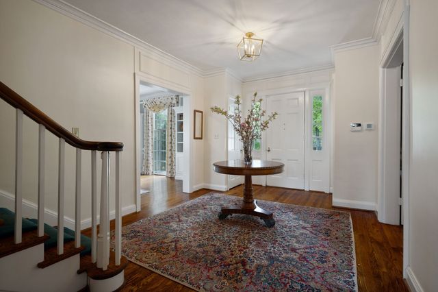 a view of a dining table and chairs in the patio