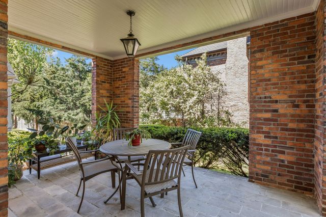 a kitchen with a stove and a wooden floor