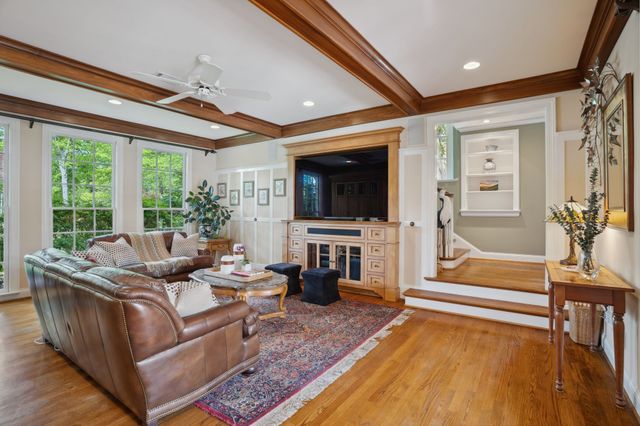 a bedroom with a bed and a night stand