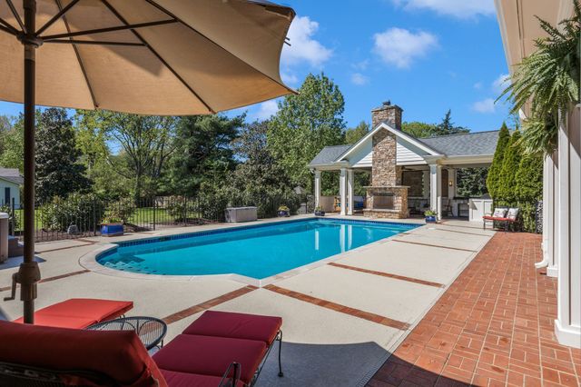 a kitchen with stainless steel appliances a stove and a large window