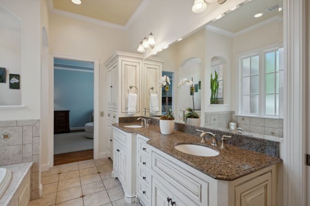 a utility room with sink dryer and washer