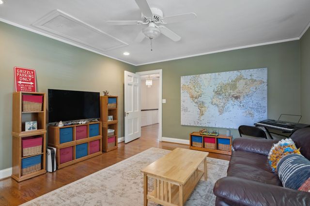 a view of house with yard outdoor seating and barbeque oven