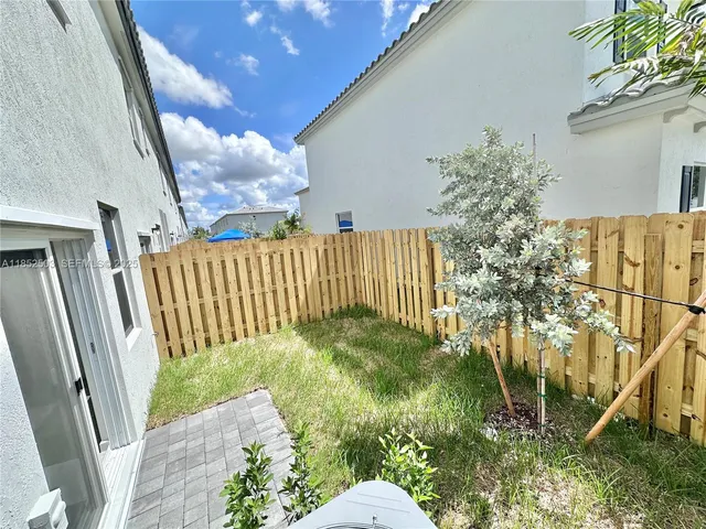 a bedroom with a bed couch and window