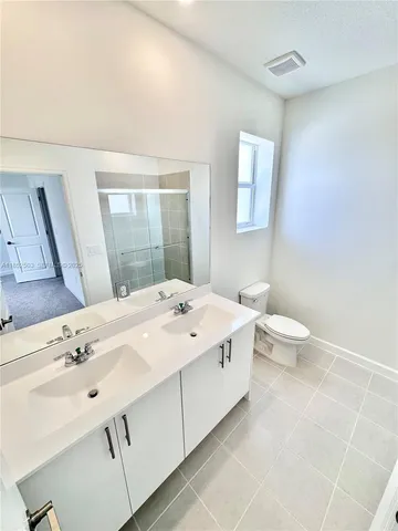 a view of an empty room and a window