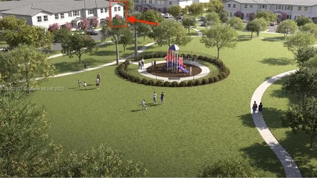 a kitchen with stainless steel appliances a dining table chairs refrigerator and microwave