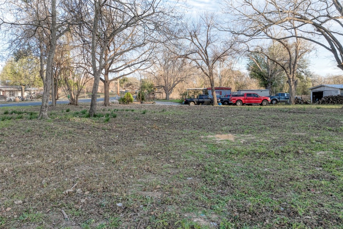 Lot 1 East Alamo Street Elgin, TX 78621 - Photo 2 of 14 a house view with a trees