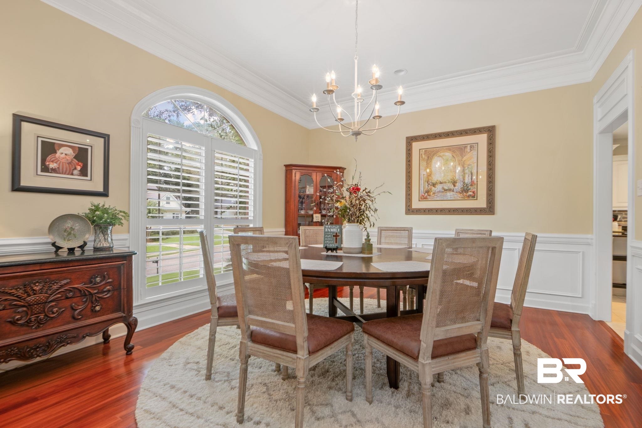 105 Beaver Dam Road Fairhope, AL 36532 - Photo 11 of 55 Dining room with dark wood-type flooring, crown molding, and a notable chandelier