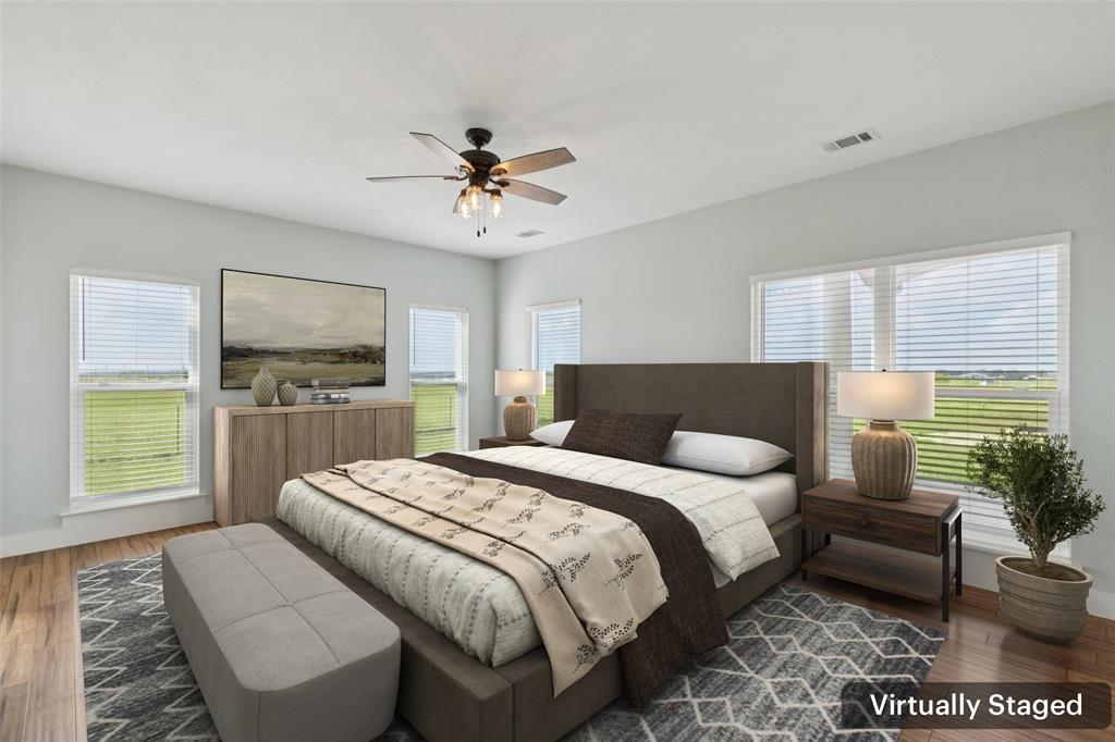 155 North Armstrong Road Venus, TX 76084 - Photo 18 of 38 a spacious bedroom with a bed a couch and a window