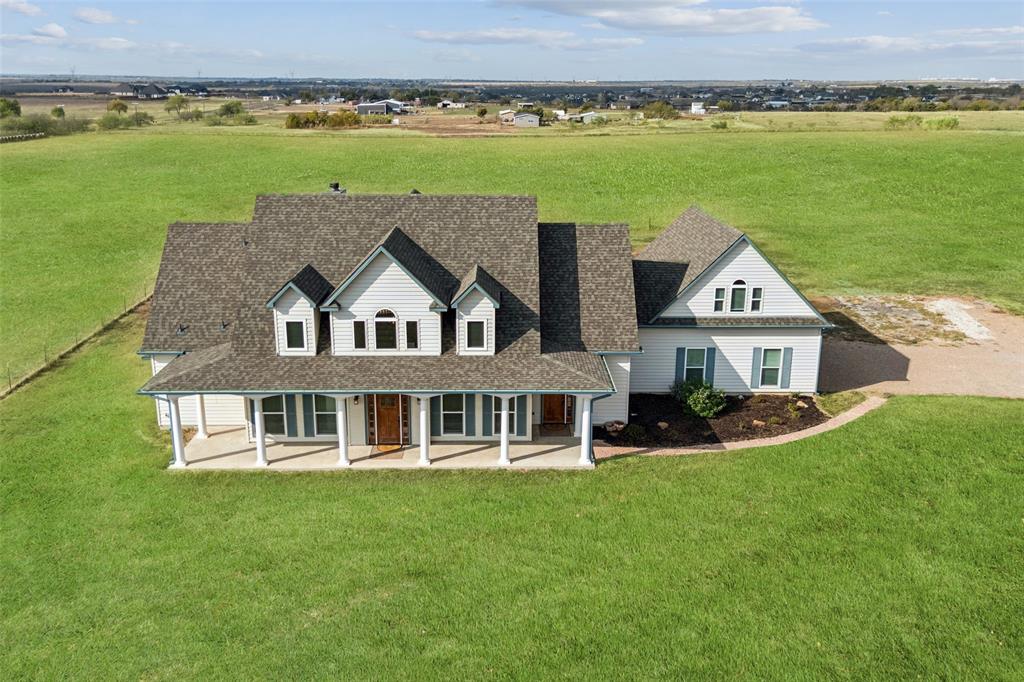 155 North Armstrong Road Venus, TX 76084 - Photo 2 of 38 a aerial view of a house with a garden and lake view