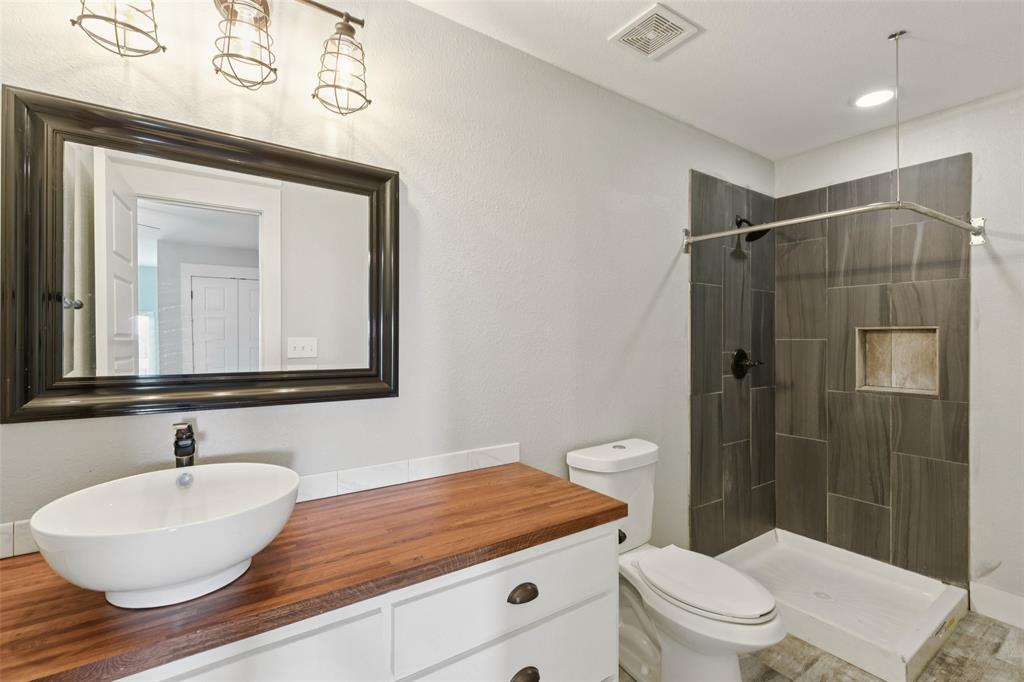 155 North Armstrong Road Venus, TX 76084 - Photo 25 of 38 a bathroom with a sink a toilet and shower