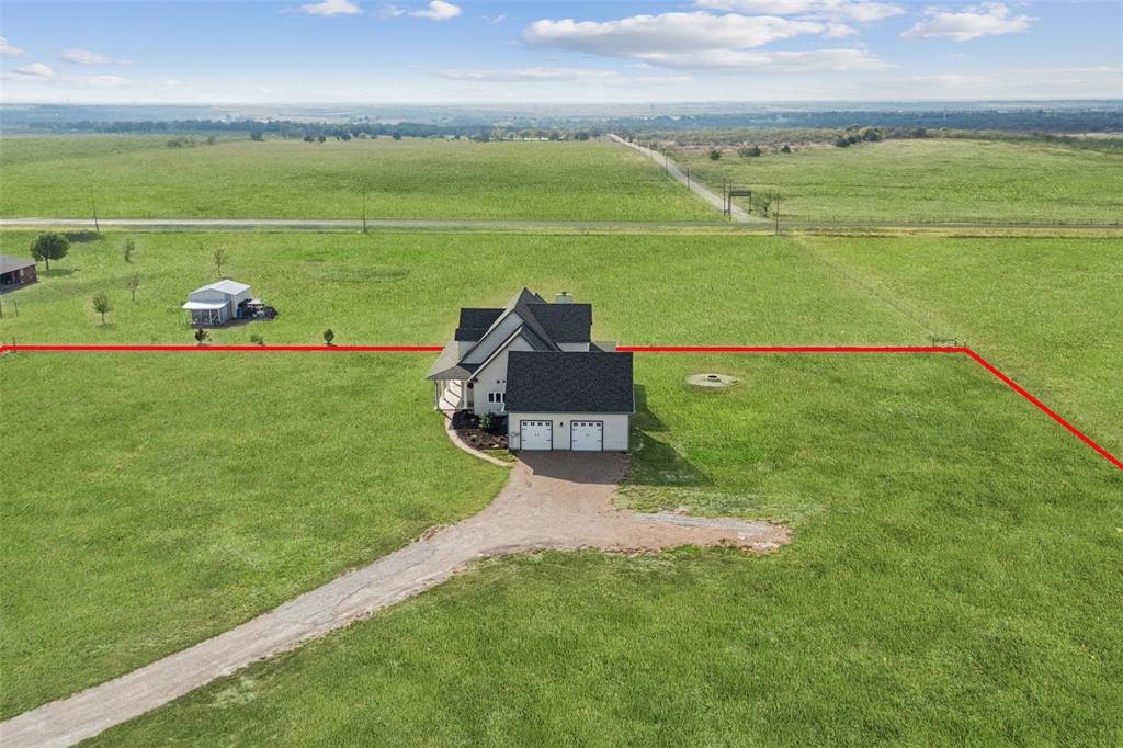 155 North Armstrong Road Venus, TX 76084 - Photo 37 of 38 a green field with some trees in the background