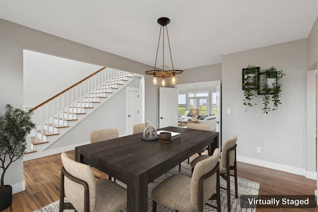 155 North Armstrong Road Venus, TX 76084 - Photo 6 of 38 a view of a dining room with furniture wooden floor and chandelier