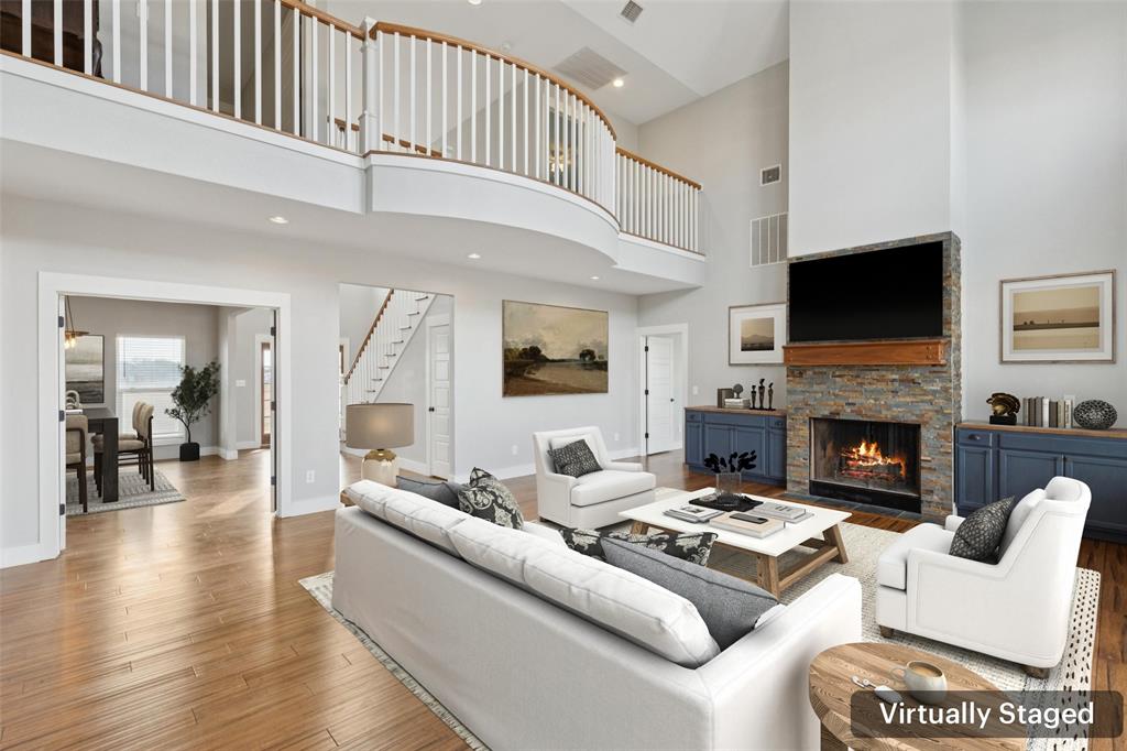 155 North Armstrong Road Venus, TX 76084 - Photo 10 of 38 a living room with furniture a fireplace and a flat screen tv