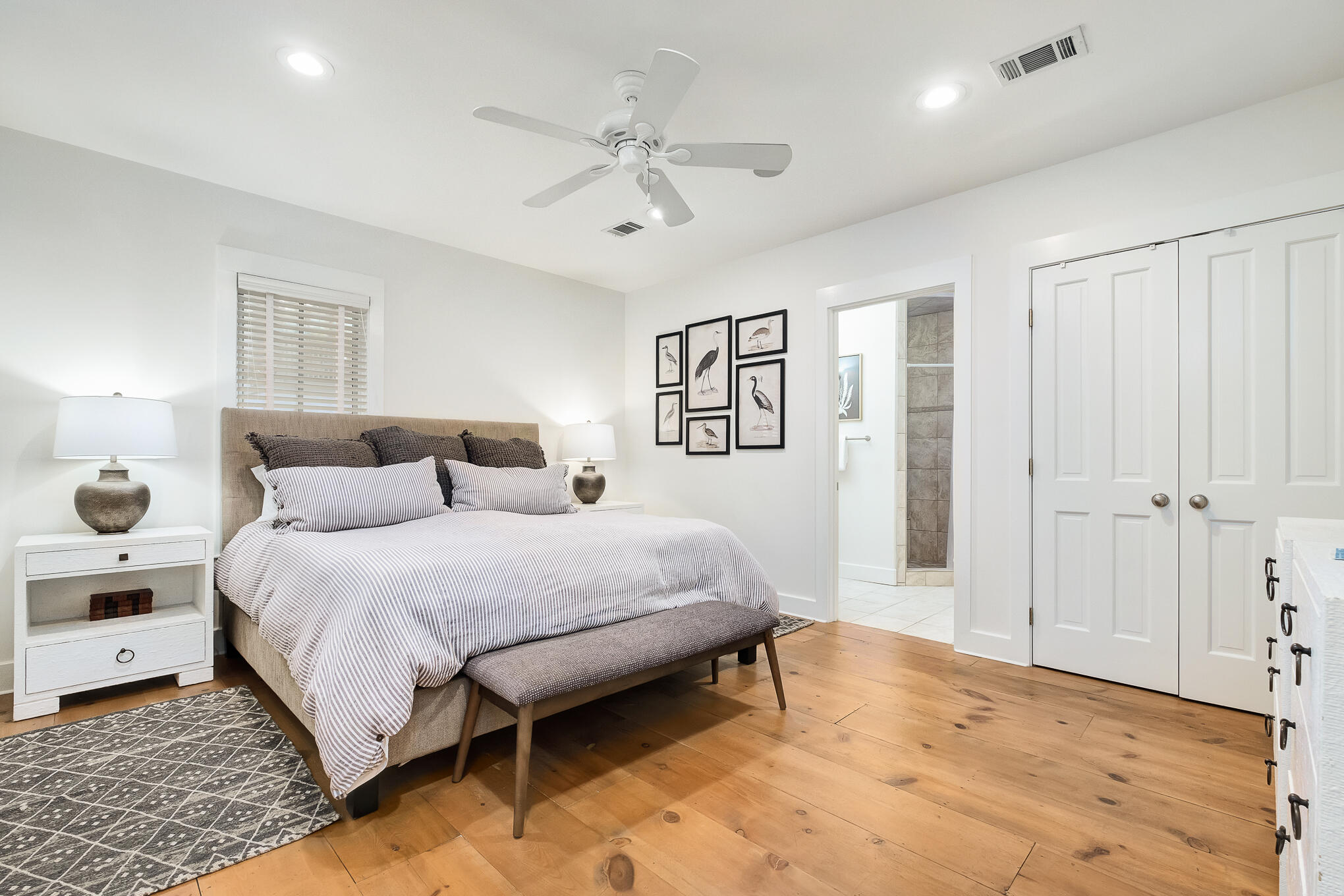 144 Round Rd Inlet Beach Inlet Beach, FL 32461 - Photo 14 of 56 a spacious bedroom with a bed and a chandelier