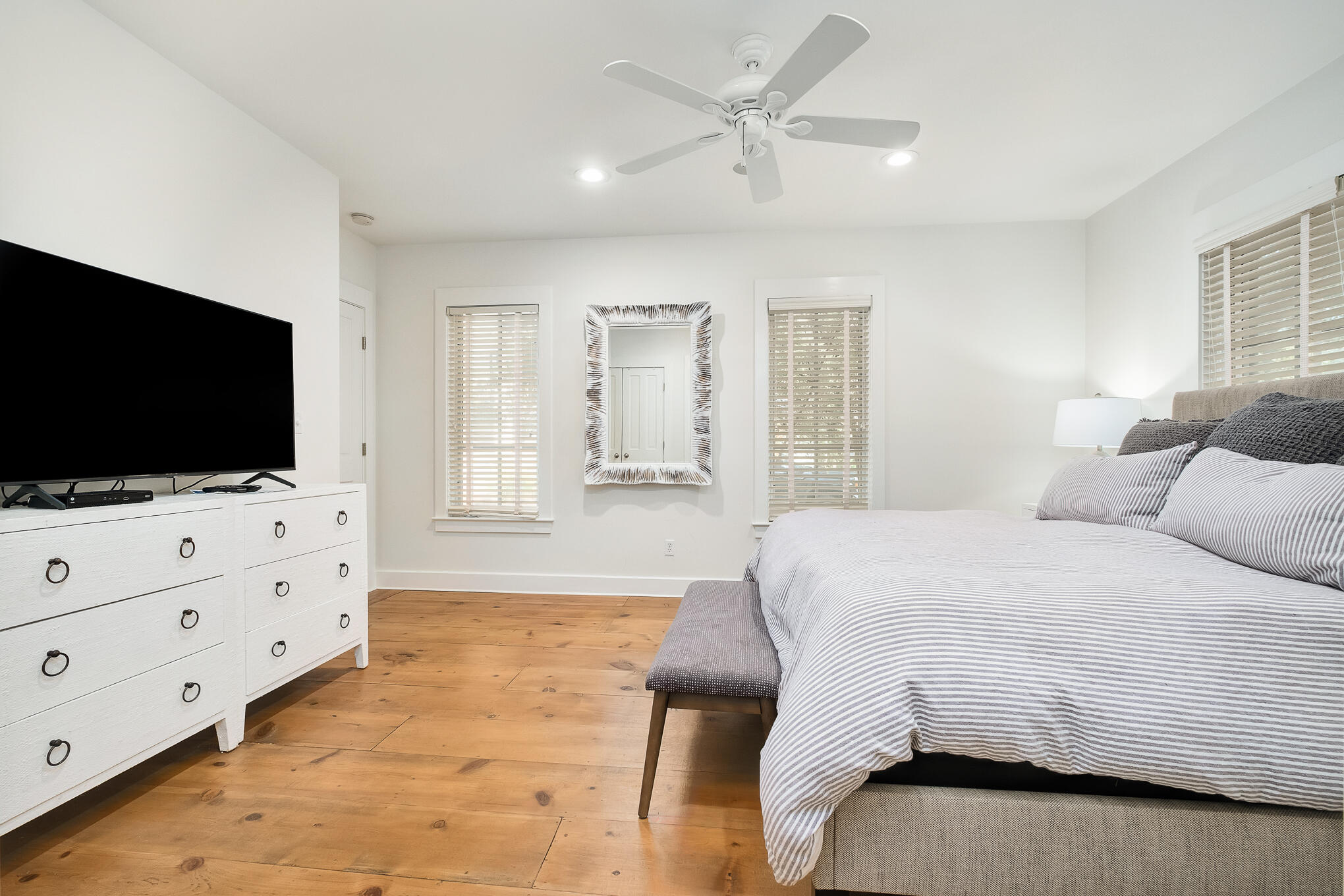 144 Round Rd Inlet Beach Inlet Beach, FL 32461 - Photo 15 of 56 a spacious bedroom with a bed and a flat screen tv