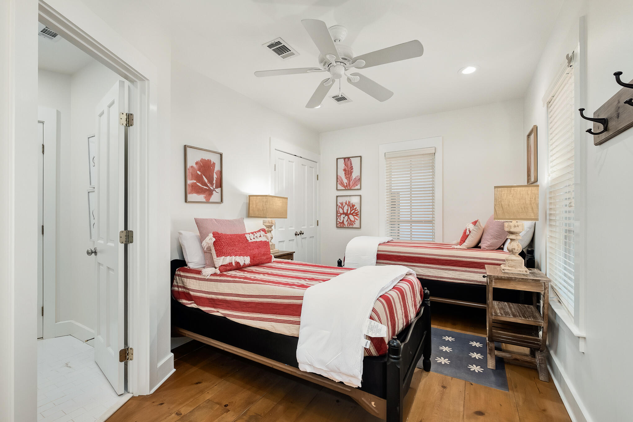 144 Round Rd Inlet Beach Inlet Beach, FL 32461 - Photo 19 of 56 a bedroom with a bed and a chandelier