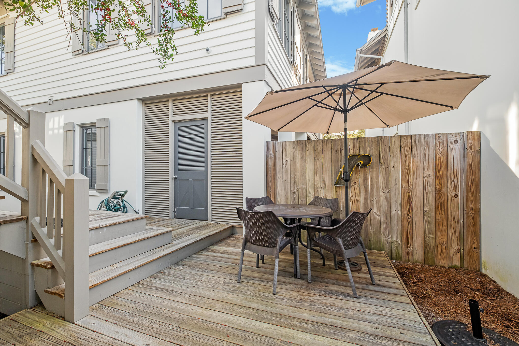 144 Round Rd Inlet Beach Inlet Beach, FL 32461 - Photo 28 of 56 a view of a dinning table and chairs in patio of the house