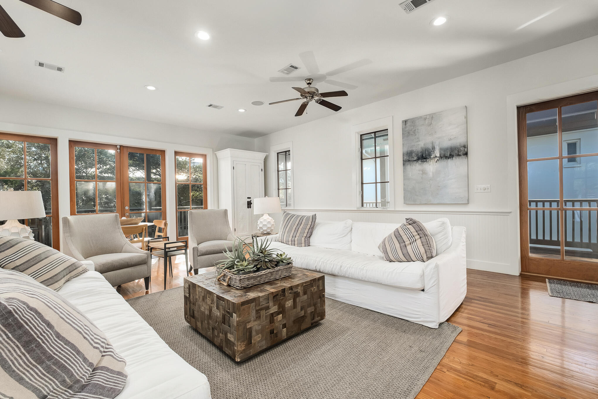 144 Round Rd Inlet Beach Inlet Beach, FL 32461 - Photo 6 of 56 a living room with furniture ceiling fan and a rug