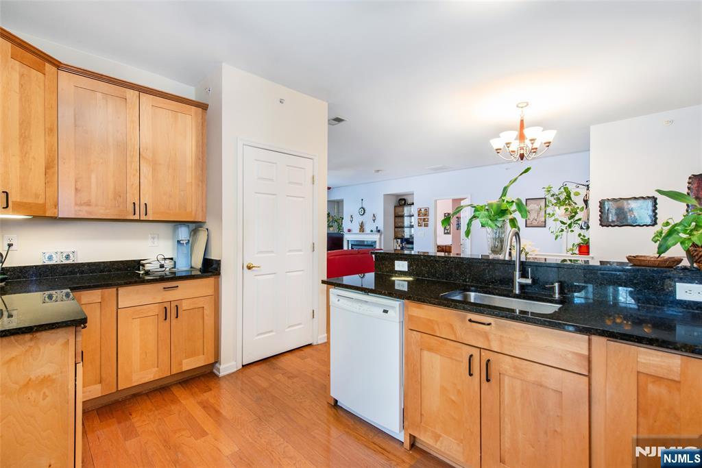 9 Cliff Road Woodland Park, NJ 07424 - Photo 14 of 25 a kitchen with granite countertop a sink stainless steel appliances and cabinets