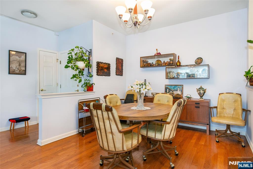 9 Cliff Road Woodland Park, NJ 07424 - Photo 15 of 25 a view of a dining room with furniture and wooden floor