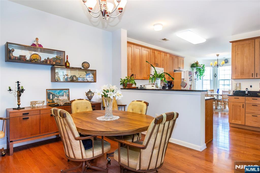 9 Cliff Road Woodland Park, NJ 07424 - Photo 16 of 25 a dining room with furniture a window and wooden floor