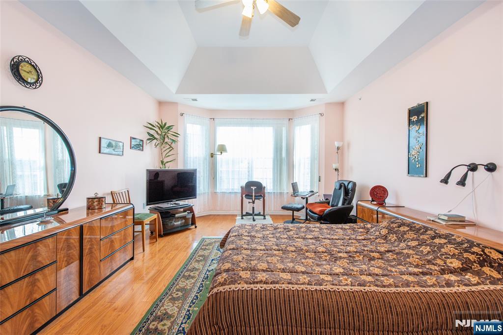 9 Cliff Road Woodland Park, NJ 07424 - Photo 2 of 25 a living room with furniture a lamp and a large window