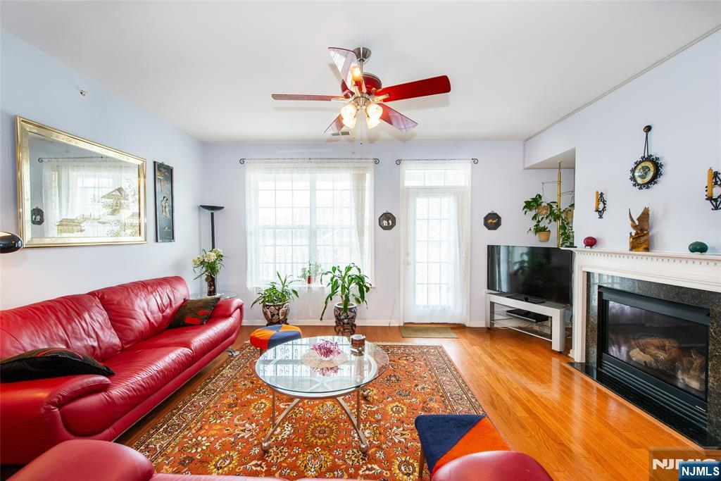 9 Cliff Road Woodland Park, NJ 07424 - Photo 22 of 25 a living room with furniture and a fireplace