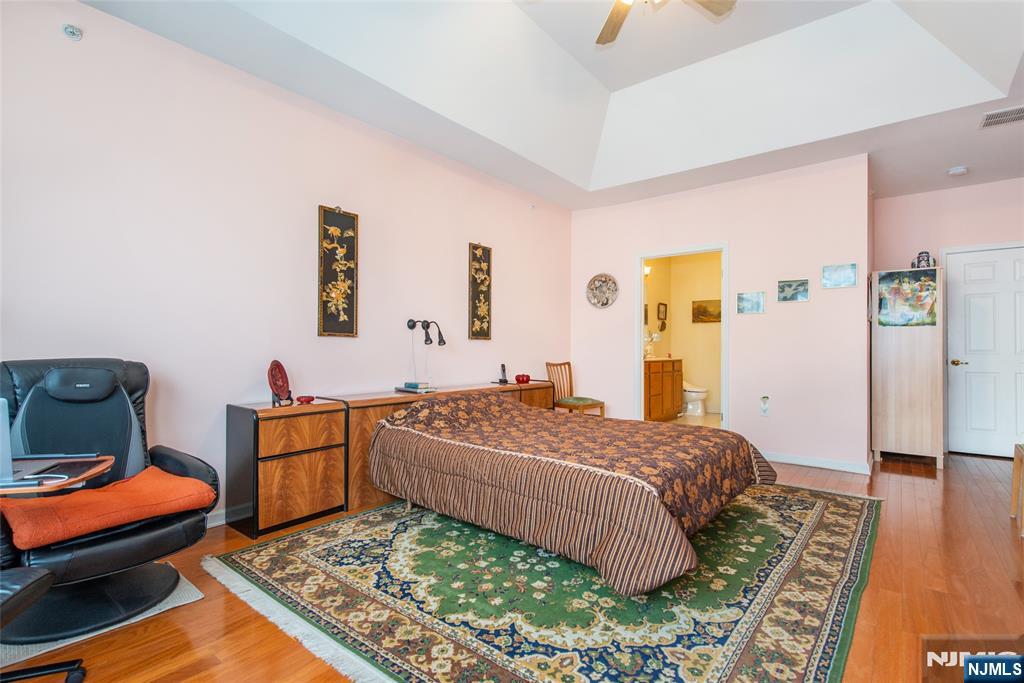 9 Cliff Road Woodland Park, NJ 07424 - Photo 3 of 25 a bedroom with a bed and wooden floor