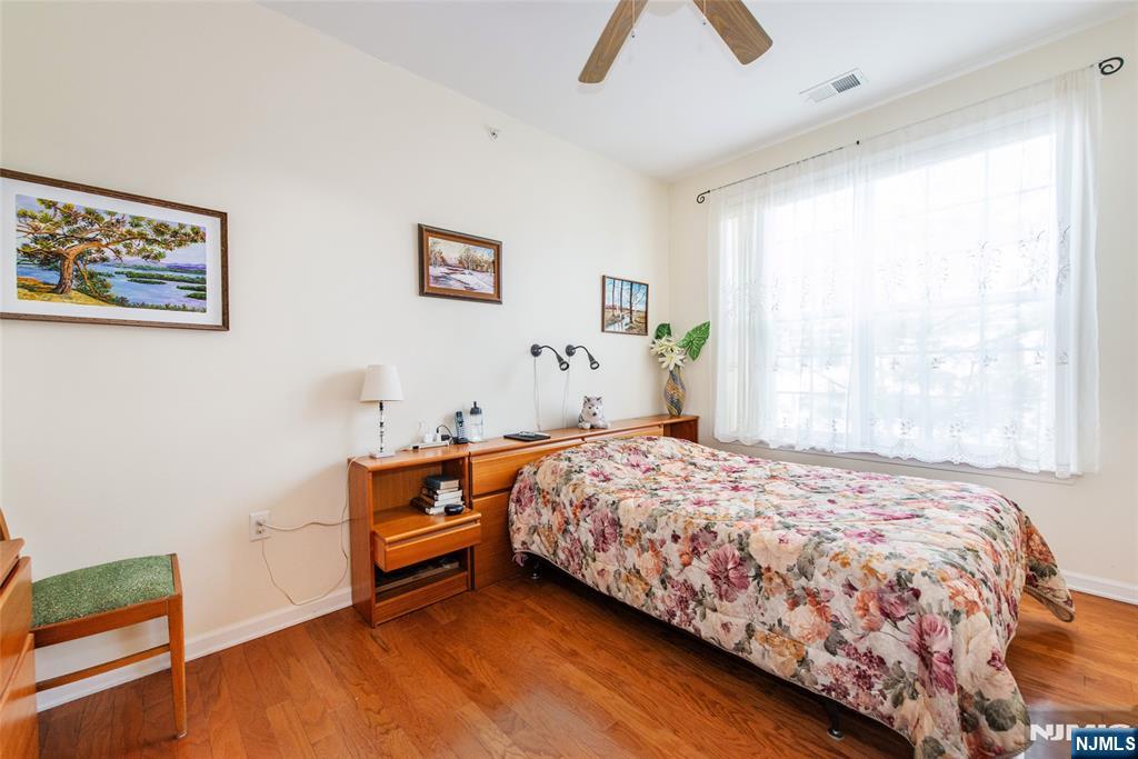 9 Cliff Road Woodland Park, NJ 07424 - Photo 7 of 25 a bedroom with a bed and a window