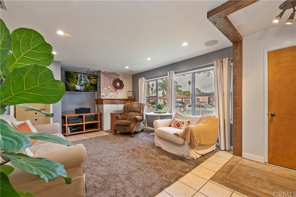 4140 St George Place Riverside, CA 92504 - Photo 16 of 29 a living room with furniture gym equipment and a large window