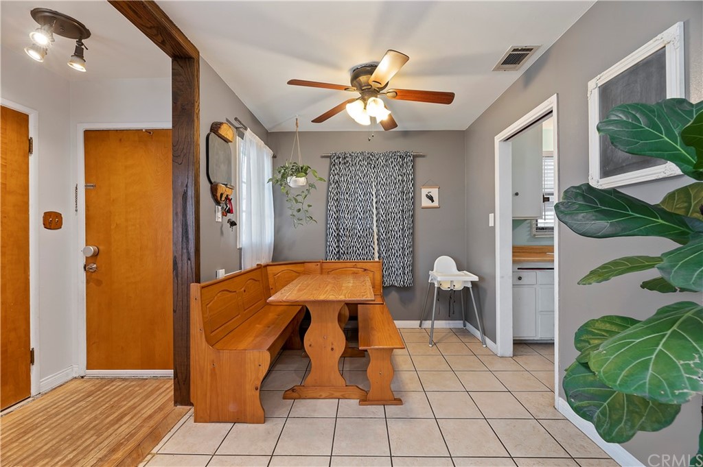 4140 St George Place Riverside, CA 92504 - Photo 17 of 29 a bedroom with a bed and a chandelier
