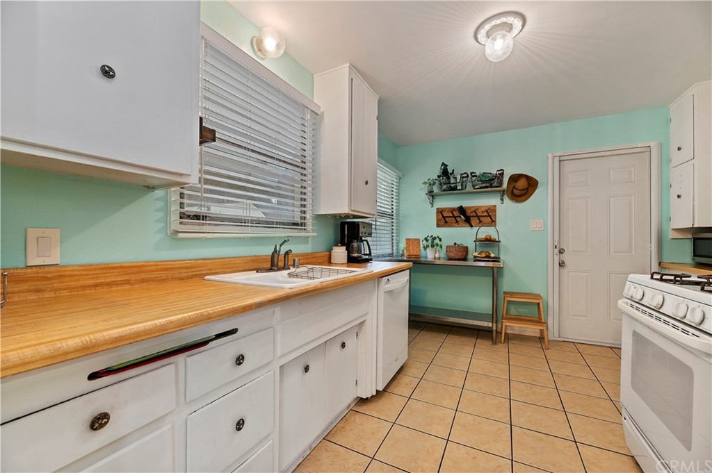 4140 St George Place Riverside, CA 92504 - Photo 25 of 29 a kitchen with a sink and cabinets