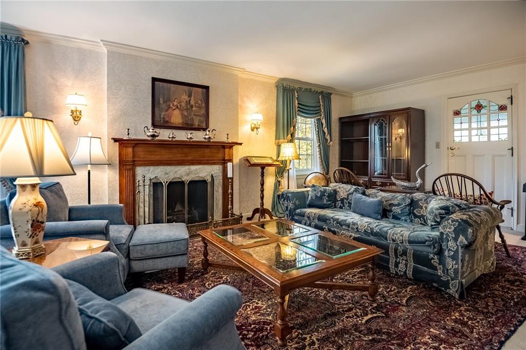1355 Yahres Road Sharon, PA 16146 - Photo 19 of 33 a living room with furniture a fireplace and a flat screen tv