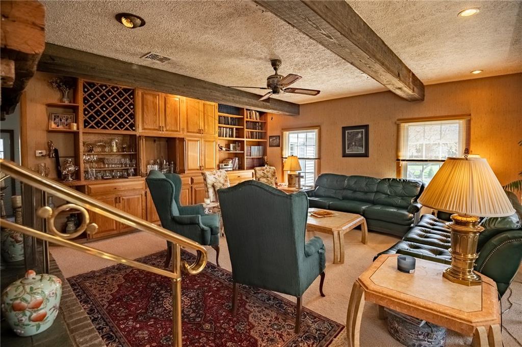 1355 Yahres Road Sharon, PA 16146 - Photo 22 of 33 a living room with a couch a dining table and chairs