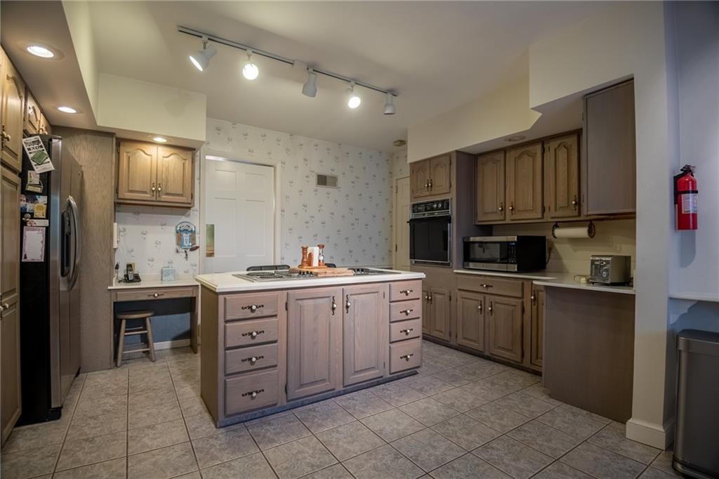 1355 Yahres Road Sharon, PA 16146 - Photo 27 of 33 a kitchen with cabinets appliances and a sink