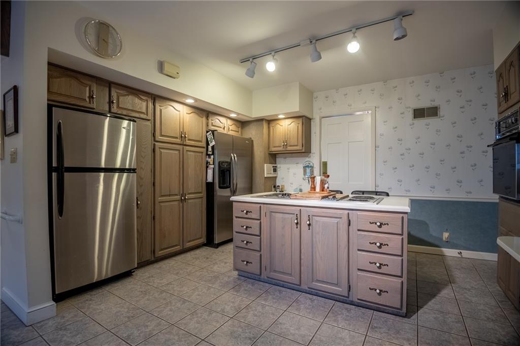 1355 Yahres Road Sharon, PA 16146 - Photo 28 of 33 a kitchen with a refrigerator and a sink