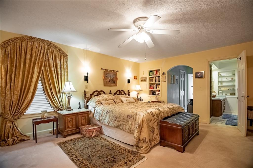 1355 Yahres Road Sharon, PA 16146 - Photo 30 of 33 a bed room with a bed and a chandelier