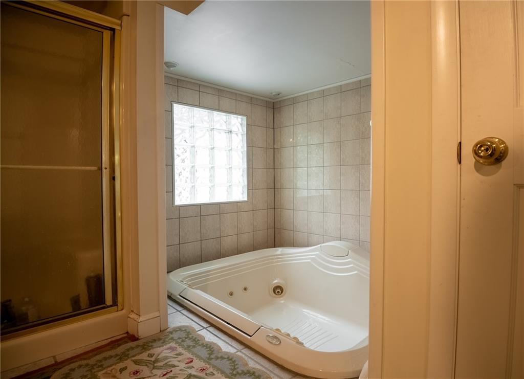 1355 Yahres Road Sharon, PA 16146 - Photo 32 of 33 a bathroom with a tub and shower