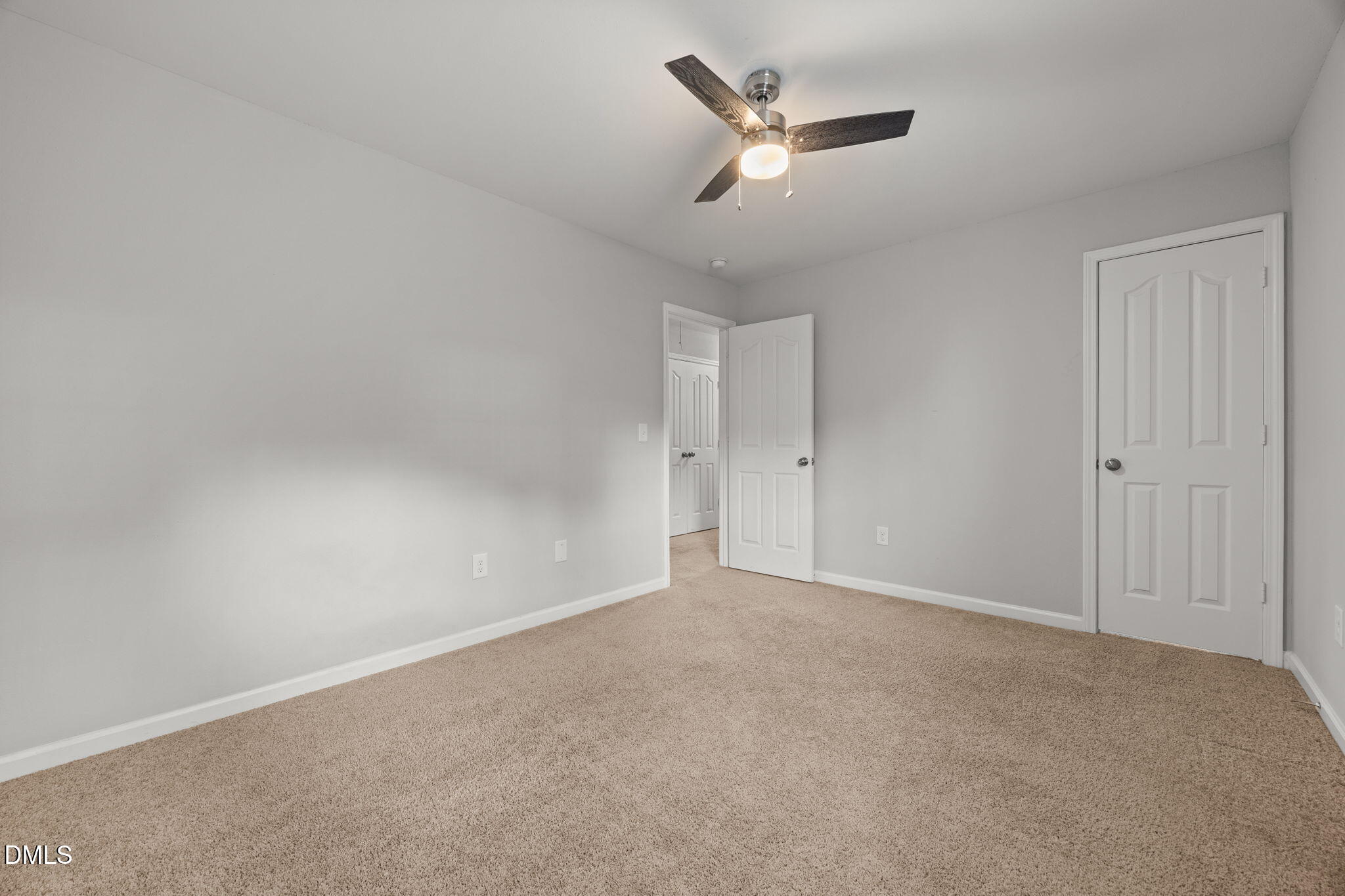 45 Crane Way Bunnlevel, NC 28323 - Photo 31 of 35 an empty room with a empty space and a ceiling fan