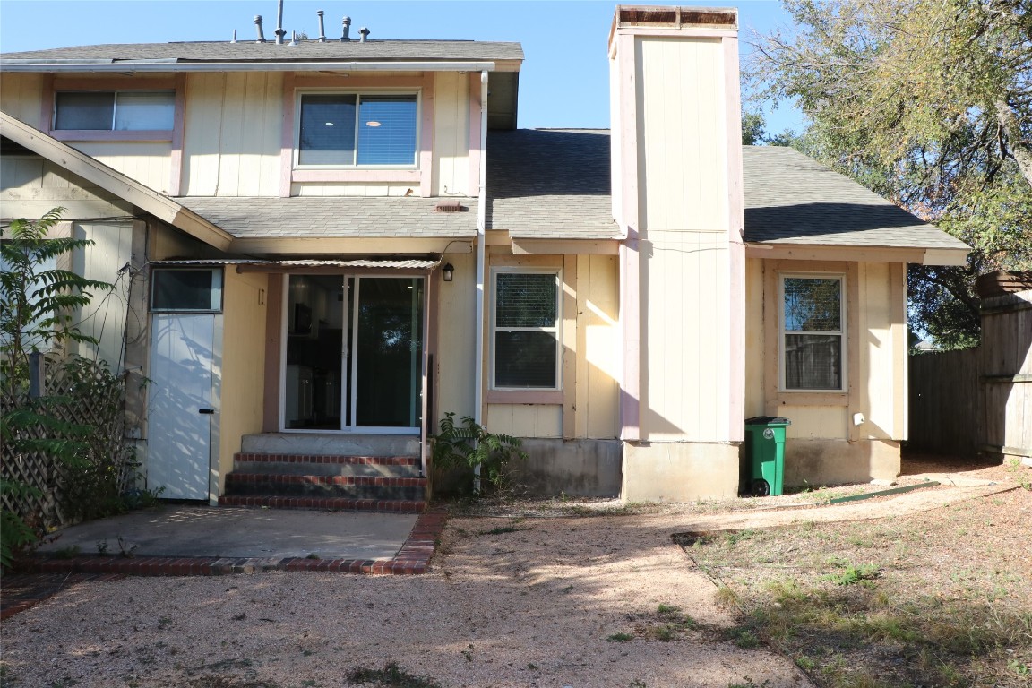 8903 Mesa Drive, Unit A Austin, TX 78759 - Photo 14 of 27 a front view of a house with a yard and garage