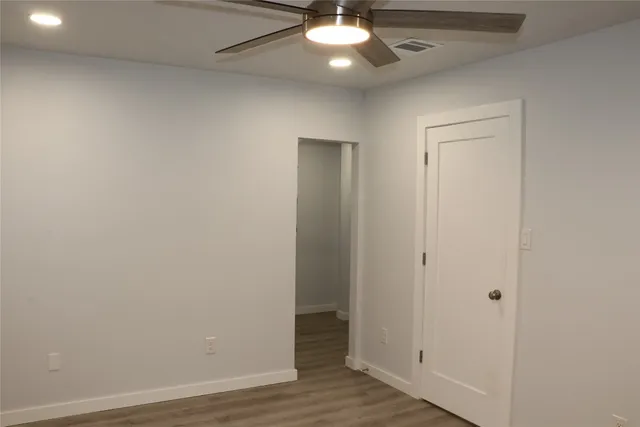 a bathroom with double sink and two mirror