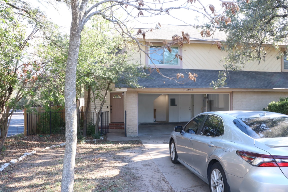 8903 Mesa Drive, Unit A Austin, TX 78759 - Photo 2 of 27 a car parked in front of house